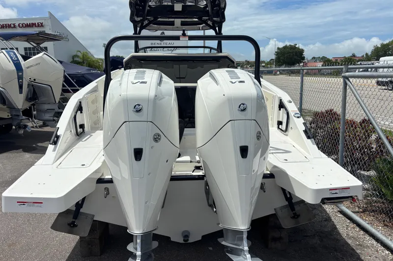 Slide: The Image of 2026 Navan S30 boat with dual Mercury outboard engines at a marina. - 6