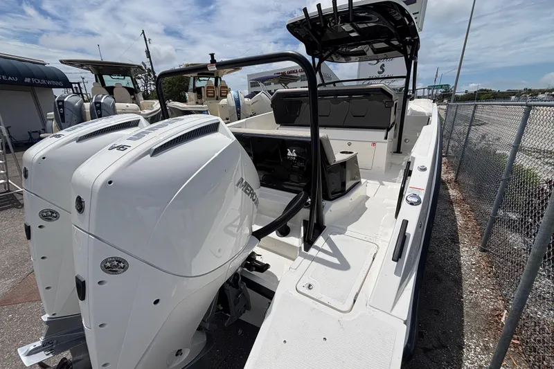 Slide: The Image of 2026 Navan S30 boat with dual Mercury outboard engines, docked outdoors. - 7