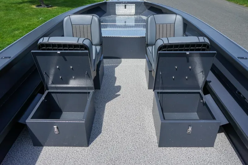 Slide: The Image of 2026 Alumaweld 23' Columbia boat interior with open storage compartments and seating. - 15