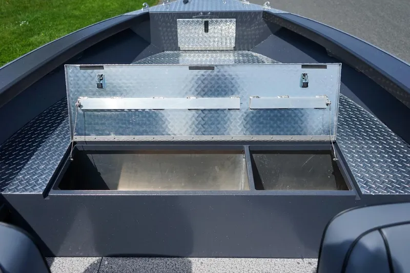 Slide: The Image of 2026 Alumaweld 23' Columbia boat storage compartments with diamond plate finish. - 18