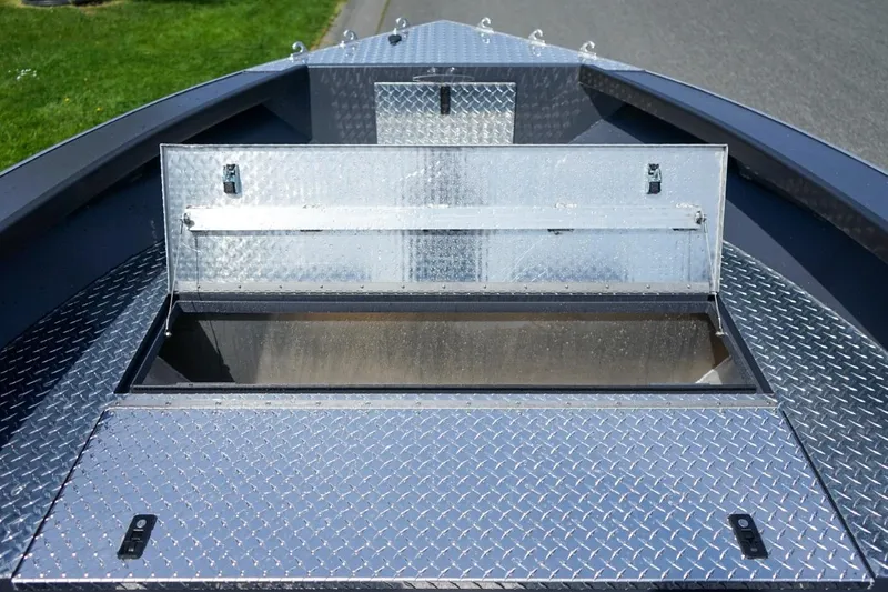 Slide: The Image of Open storage compartment on 2026 Alumaweld 23' Columbia boat with diamond plate finish. - 19
