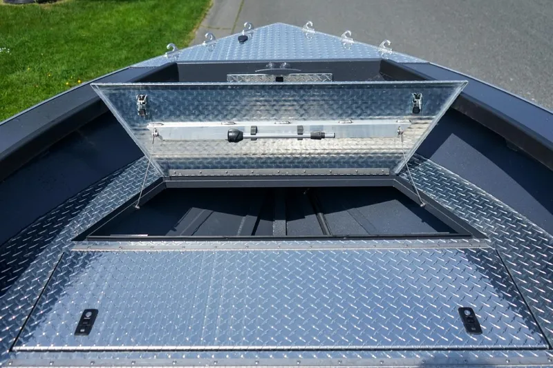 Slide: The Image of 2026 Alumaweld 23' Columbia boat with open storage compartment on diamond plate deck. - 20
