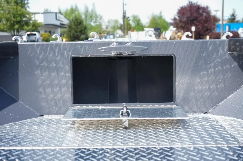 Slide: The Image of Alumaweld 23' Columbia 2026 boat storage compartment with diamond plate flooring. - 21