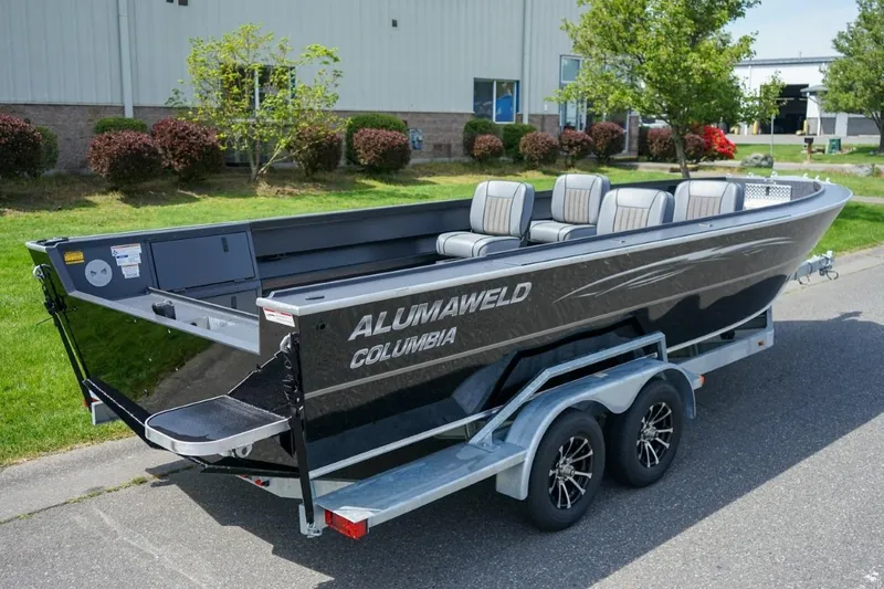 Slide: The Image of 2026 Alumaweld 23' Columbia boat on trailer, parked outdoors. - 3