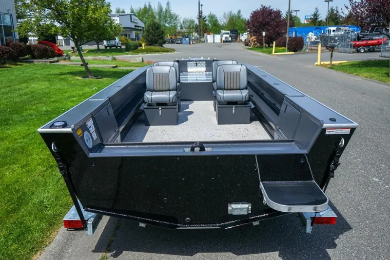 Slide: The Image of 2026 Alumaweld 23' Columbia boat with spacious seating, parked on a sunny day. - 4