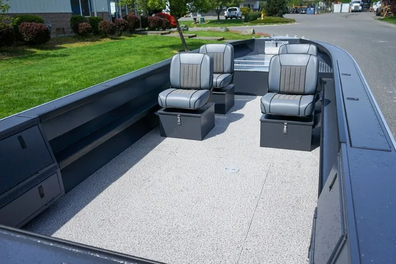 Slide: The Image of 2026 Alumaweld 23' Columbia boat interior with four gray seats on a spacious deck. - 5