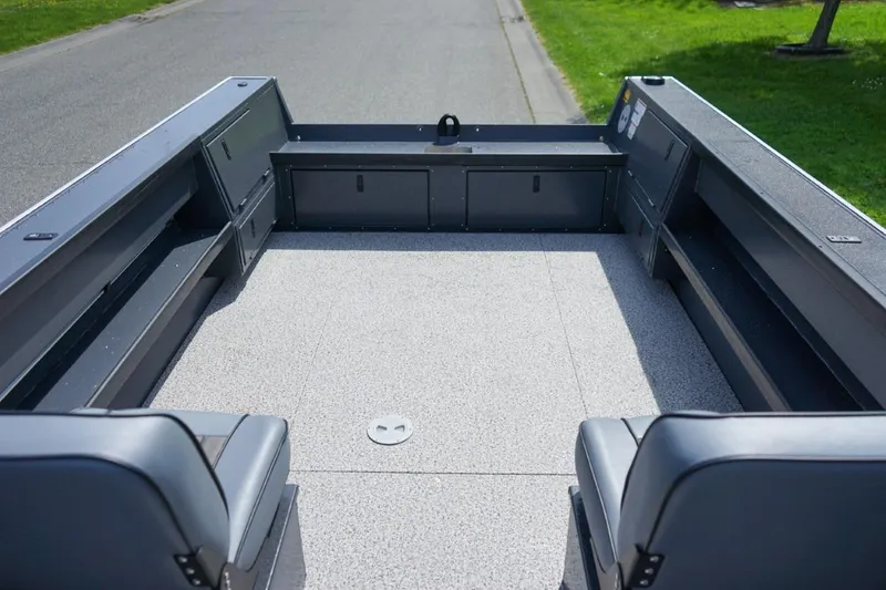 Slide: The Image of 2026 Alumaweld 23' Columbia boat interior with spacious seating and storage compartments. - 6