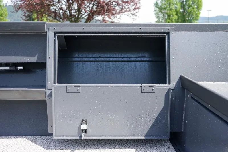 Slide: The Image of Open storage compartment on 2026 Alumaweld 23' Columbia boat, featuring sleek design. - 9
