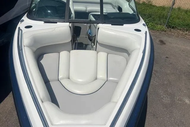Slide: The Image of 2000 Malibu Sunsetter VLX boat with white and gray interior seating. - 3