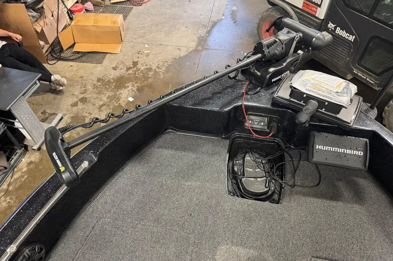 Slide: The Image of 2021 Nitro ZV19 Sport boat interior with Minn Kota trolling motor and Humminbird electronics. - 11