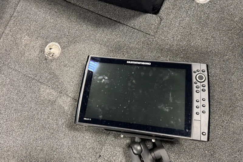 Slide: The Image of Fishfinder device on a 2021 Nitro ZV19 Sport boat's carpeted floor. - 13