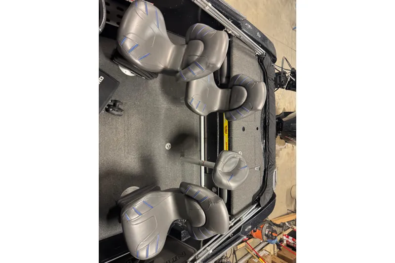 Slide: The Image of 2021 Nitro ZV19 Sport boat interior with four gray seats. - 19