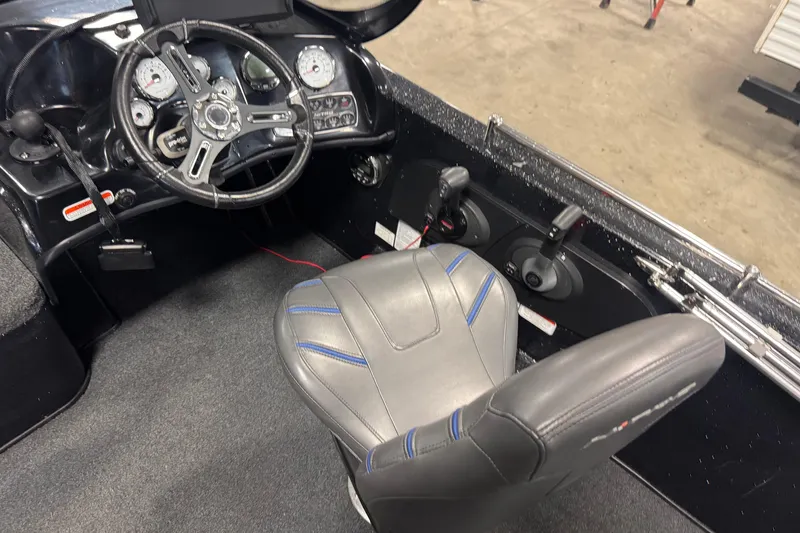 Slide: The Image of 2021 Nitro ZV19 Sport boat cockpit with steering wheel and controls. - 6