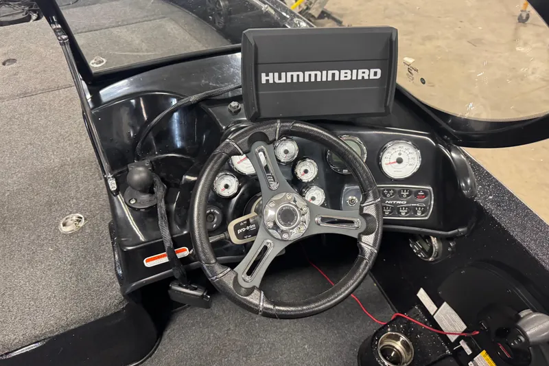 Slide: The Image of Steering console of 2021 Nitro ZV19 Sport boat with Humminbird display and gauges. - 7