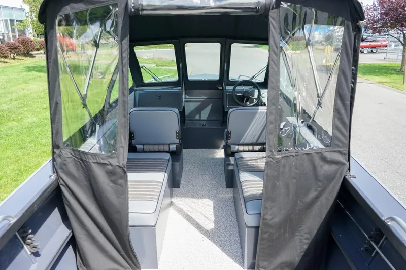 Slide: The Image of Interior view of 2026 Alumaweld X202 Stryker boat with seating and steering wheel. - 10