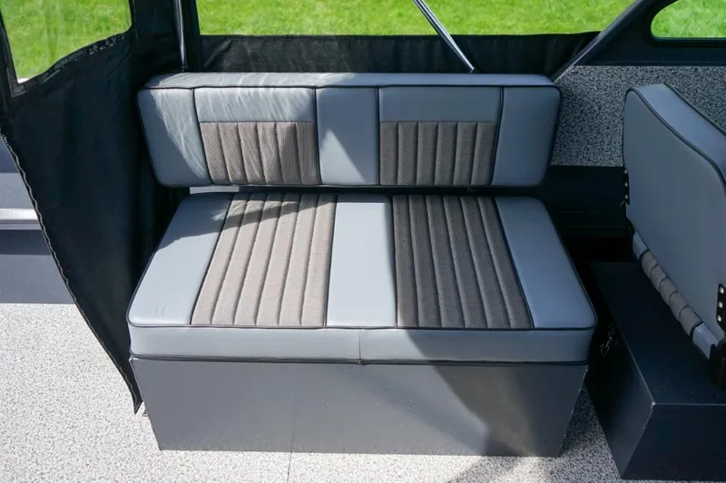 Slide: The Image of 2026 Alumaweld X202 Styker boat interior with gray cushioned seating. - 13