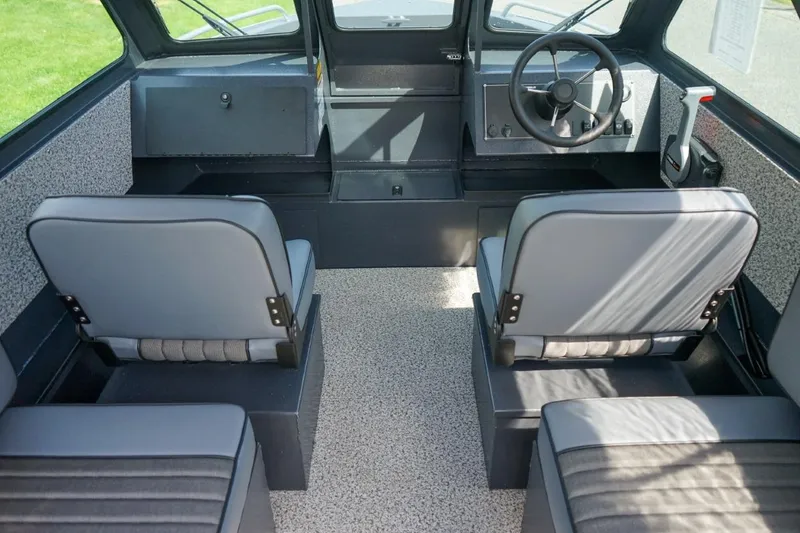 Slide: The Image of Interior of 2026 Alumaweld X202 Stryker boat with seating and steering wheel. - 15