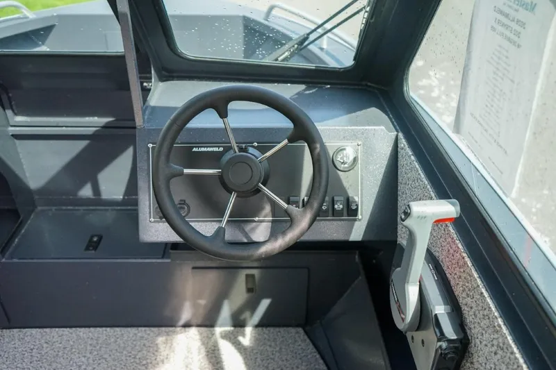 Slide: The Image of 2026 Alumaweld X202 Stryker boat steering console with controls and dashboard. - 18