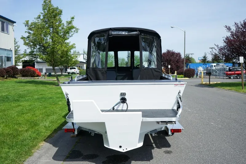 Slide: The Image of 2026 Alumaweld X202 Styker boat, rear view, parked on a street. - 4