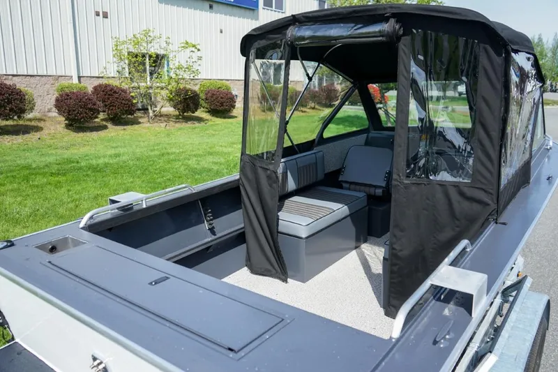 Slide: The Image of 2026 Alumaweld X202 Stryker boat with canopy, showcasing spacious interior and seating. - 5