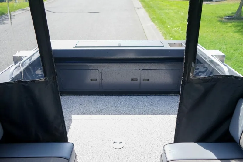 Slide: The Image of 2026 Alumaweld X202 Stryker boat interior with seating and storage compartments. - 6