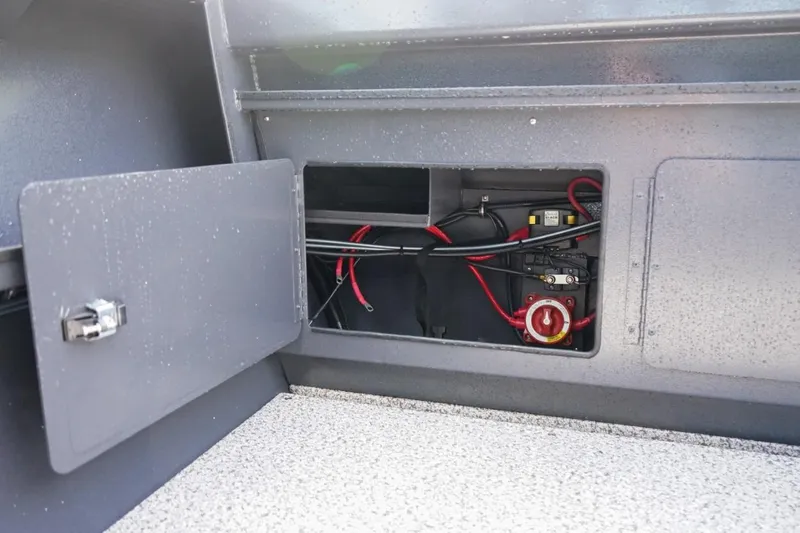 Slide: The Image of 2026 Alumaweld X202 Stryker boat compartment with wiring and battery switch. - 8
