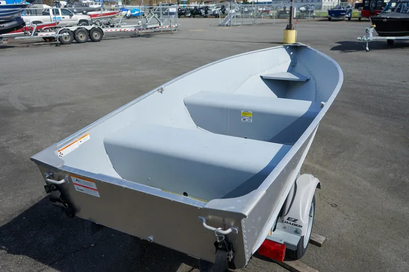 Slide: The Image of 2021 Lund WC-12 aluminum boat on trailer in parking lot. - 10
