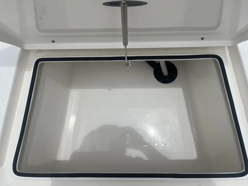 Slide: The Image of Open storage compartment in 2022 Pathfinder 2400 boat. - 17