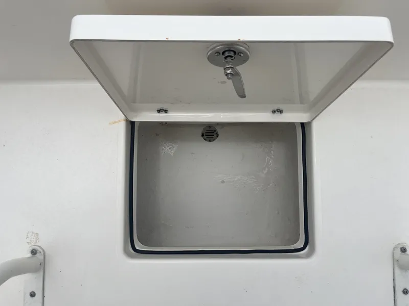 Slide: The Image of Open storage compartment on a 2022 Pathfinder 2400 boat. - 31