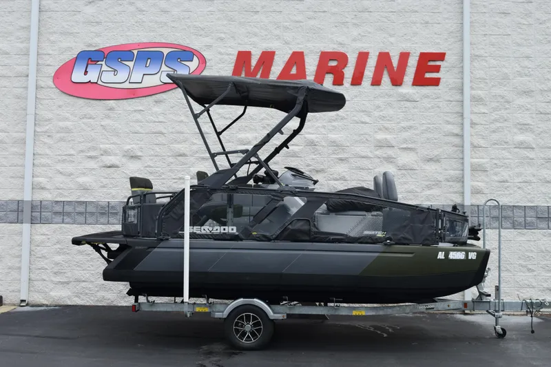 The Image of 2025 Sea-Doo Switch Fish 18 pontoon boat on trailer at GSPS Marine dealership. - 1