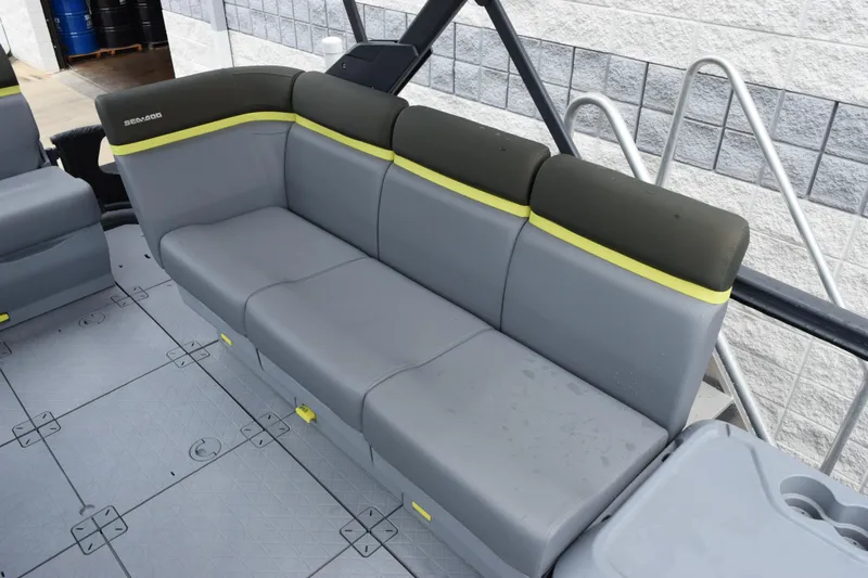 Slide: The Image of 2025 Sea-Doo Switch Fish 18 interior seating with gray and yellow accents. - 14