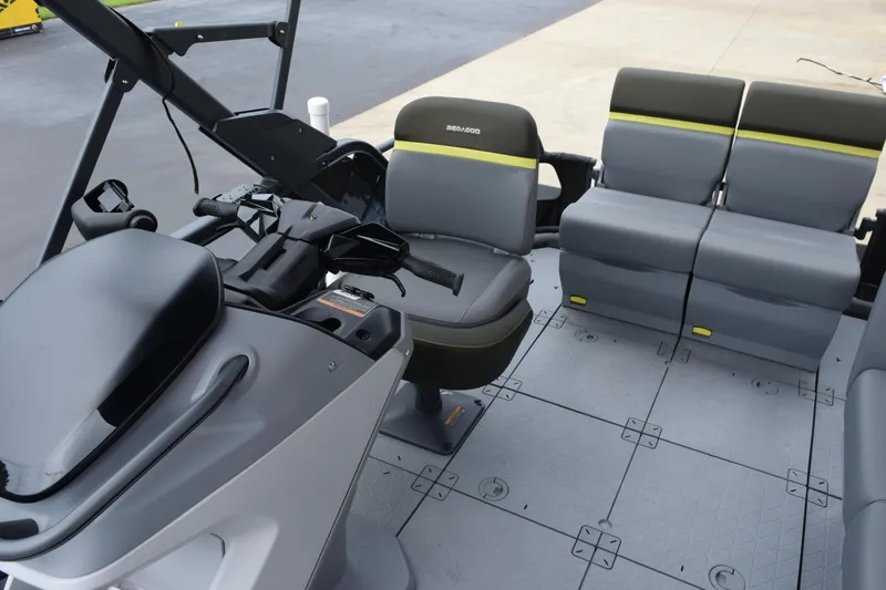 Slide: The Image of 2025 Sea-Doo Switch Fish 18 interior with seating and controls. - 15