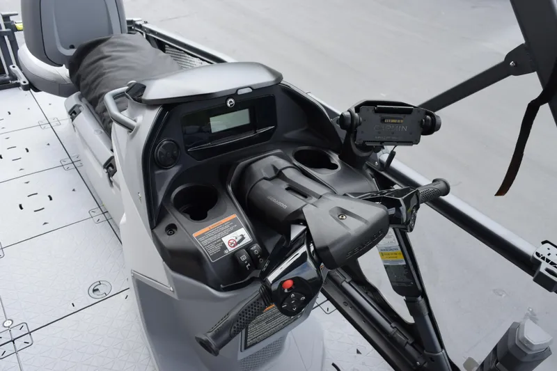 Slide: The Image of 2025 Sea-Doo Switch Fish 18 dashboard with controls and navigation system. - 16