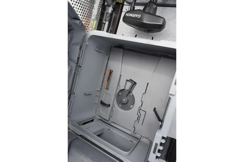 Slide: The Image of Interior storage compartment of 2025 Sea-Doo Switch Fish 18 with Garmin equipment. - 19