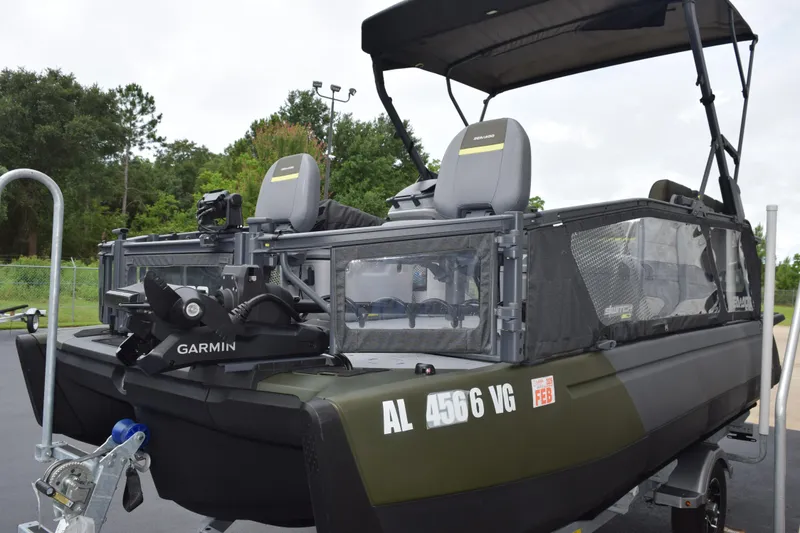 Slide: The Image of 2025 Sea-Doo Switch Fish 18 boat with Garmin equipment, parked on a trailer. - 4