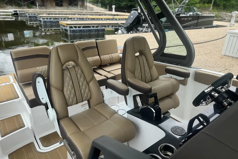 Slide: The Image of Luxurious interior of 2026 Monterey Elite 25 SD boat with plush seating and modern controls. - 4