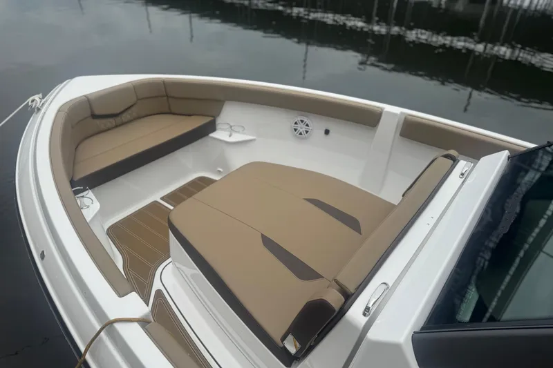 Slide: The Image of 2026 Monterey Elite 25 SD boat interior with tan seating and sleek design. - 6