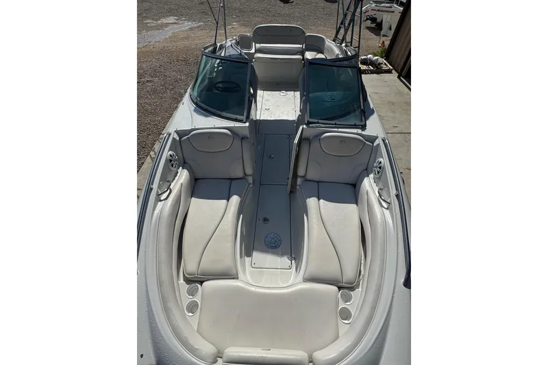 Slide: The Image of 2005 Crownline 240 EX boat with spacious seating and sleek design. - 14