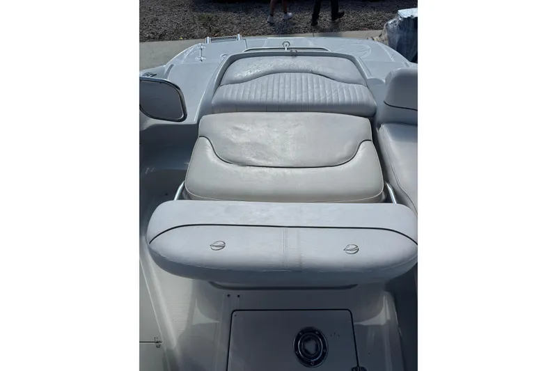 Slide: The Image of 2005 Crownline 240 EX boat interior with cushioned seating and sleek design. - 26