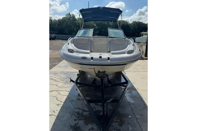Slide: The Image of 2005 Crownline 240 EX boat on trailer, sunny day, front view. - 4