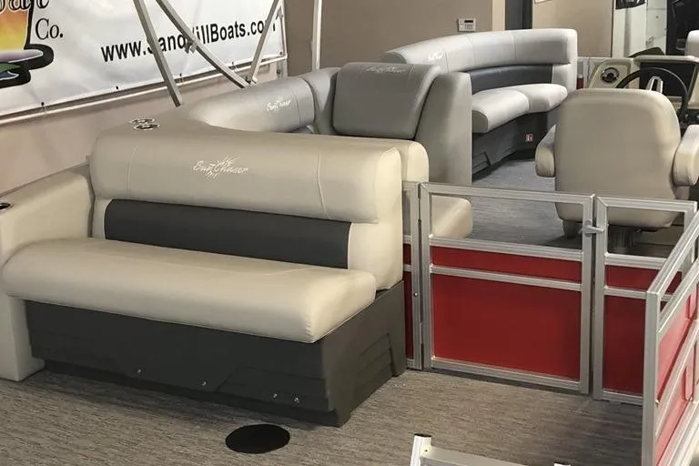 Slide: The Image of Luxurious interior of 2026 SunChaser Vista 20 CRB pontoon boat with plush seating. - 2