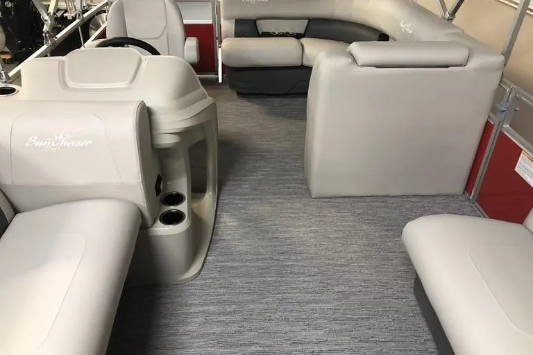 Slide: The Image of Interior of 2026 SunChaser Vista 20 CRB pontoon boat with beige seating and helm. - 3