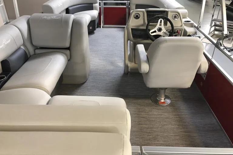 Slide: The Image of Interior of 2026 SunChaser Vista 20 CRB pontoon boat with plush seating and modern helm. - 4