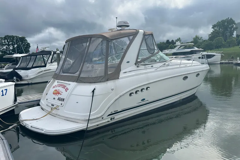 The Image of 2005 Chaparral Signature 350 boat docked in a marina under cloudy skies. - 0