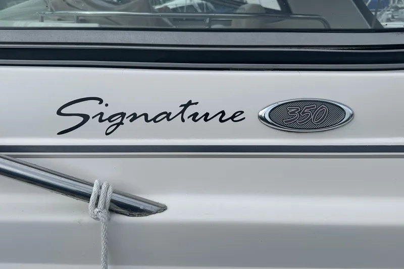 Slide: The Image of 2005 Chaparral Signature 350 boat emblem with rope detail. - 12