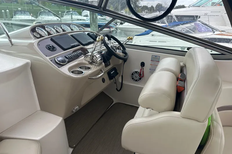 Slide: The Image of Interior cockpit of 2005 Chaparral Signature 350 boat with steering wheel and controls. - 16