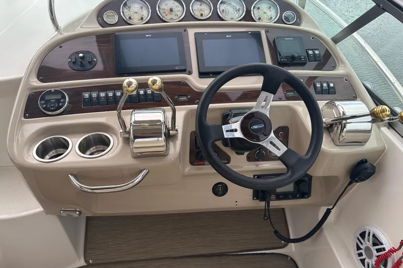 Slide: The Image of Cockpit of 2005 Chaparral Signature 350 boat with steering wheel and control panel. - 17