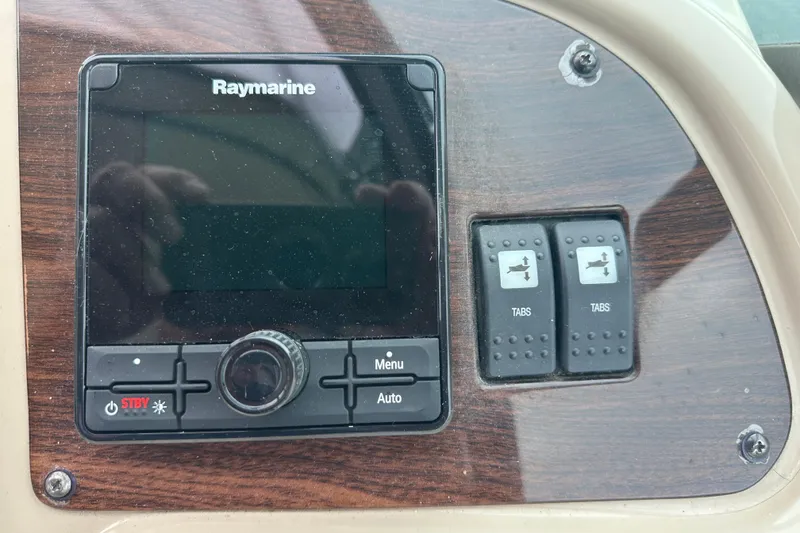 Slide: The Image of Raymarine control panel on 2005 Chaparral Signature 350 boat dashboard. - 19
