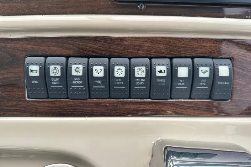 Slide: The Image of Control panel of a 2005 Chaparral Signature 350 boat with labeled switches. - 20