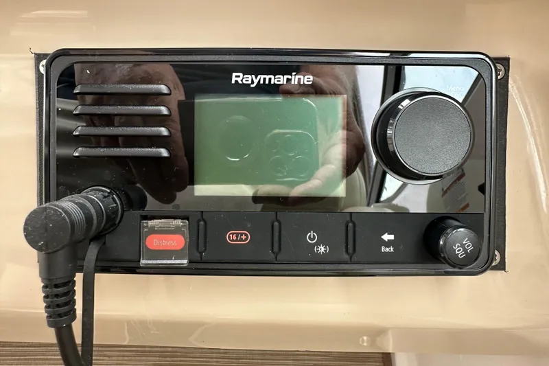 Slide: The Image of Raymarine marine radio on 2005 Chaparral Signature 350 boat dashboard. - 22